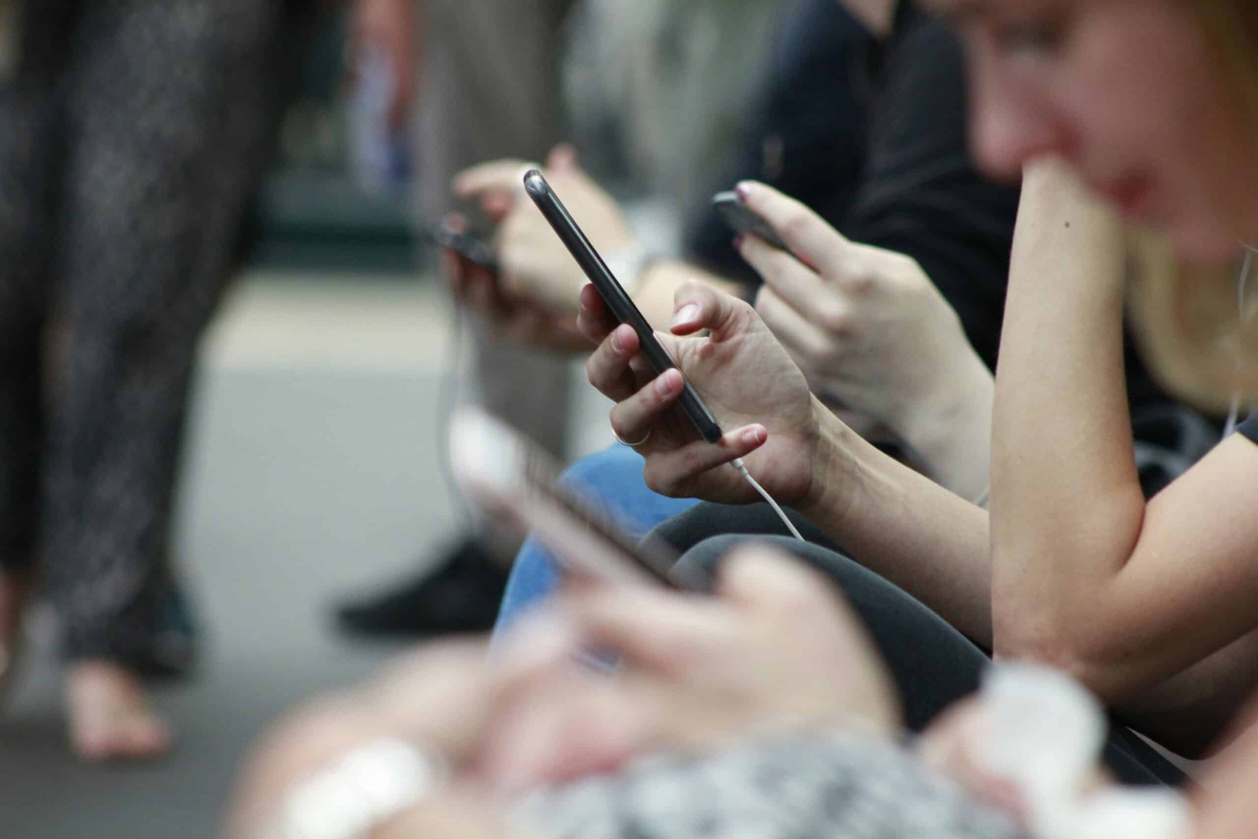 People holding their phones